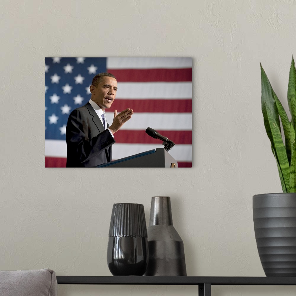 A modern room featuring BARACK OBAMA (1961- ). 44th President of the United States. President Barack Obama delivering a s...
