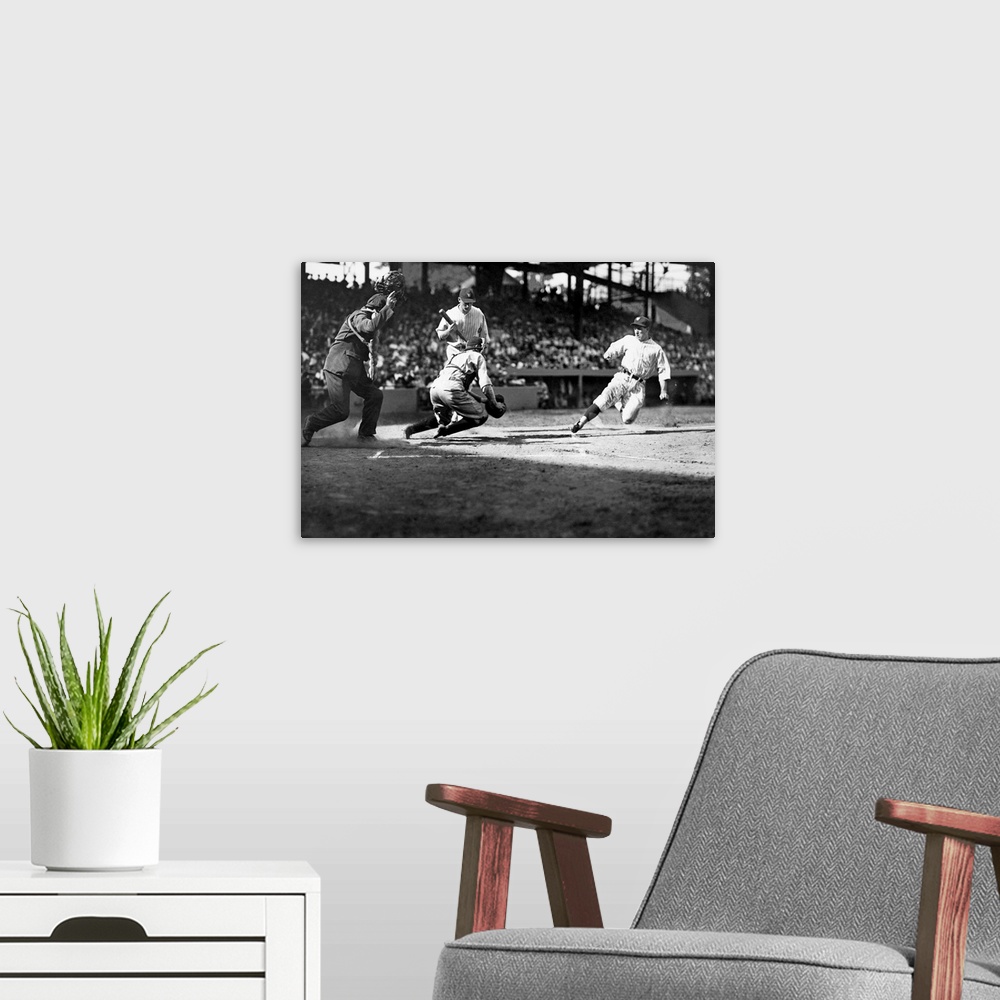 A modern room featuring Bucky Harris of the Washington Nationals sliding into home plate, 1925.