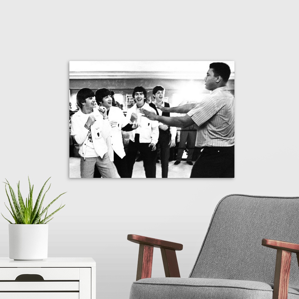 A modern room featuring The Beatles (from left: Ringo Starr, John Lennon, George Harrison, and Paul McCartney) clowning w...