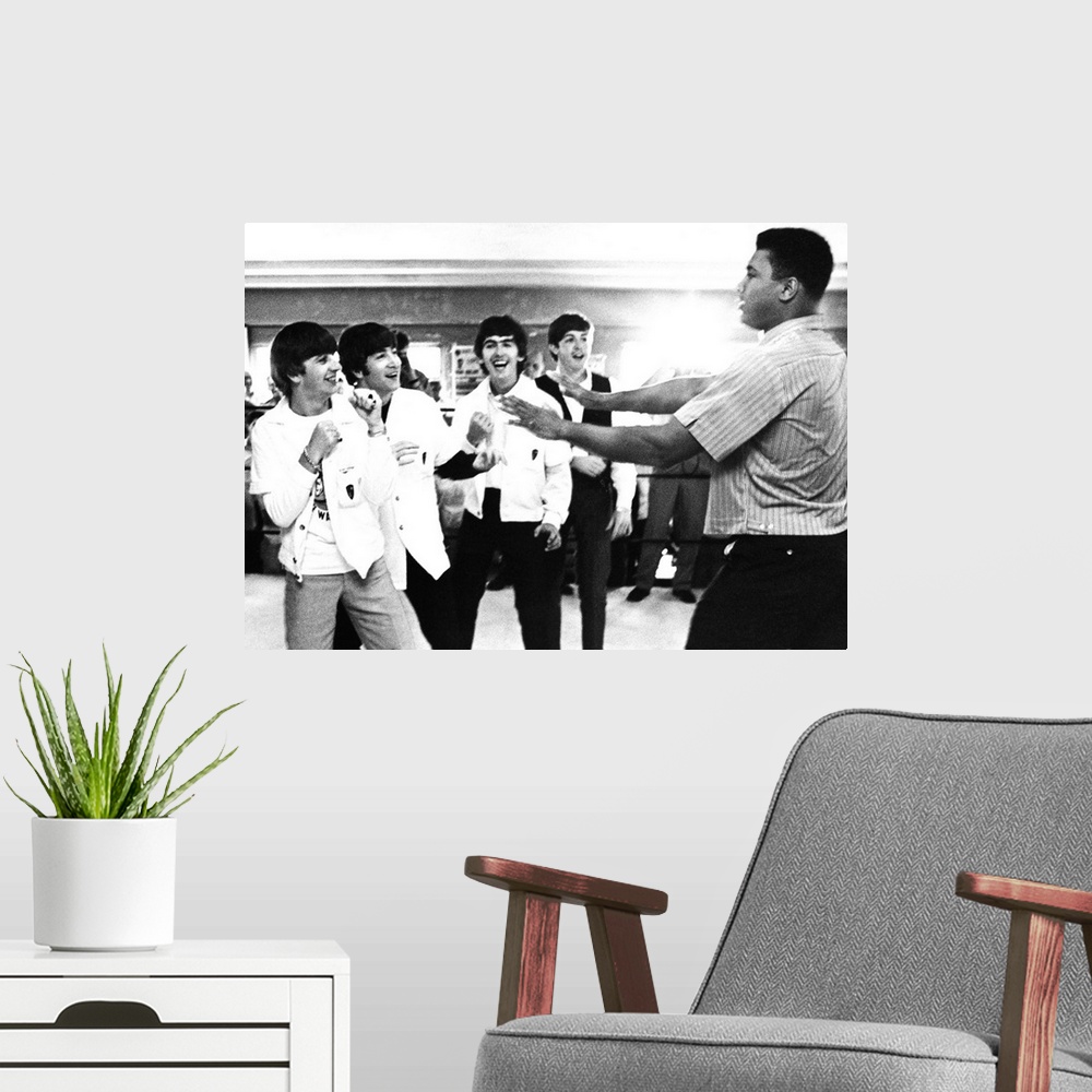 A modern room featuring The Beatles (from left: Ringo Starr, John Lennon, George Harrison, and Paul McCartney) clowning w...