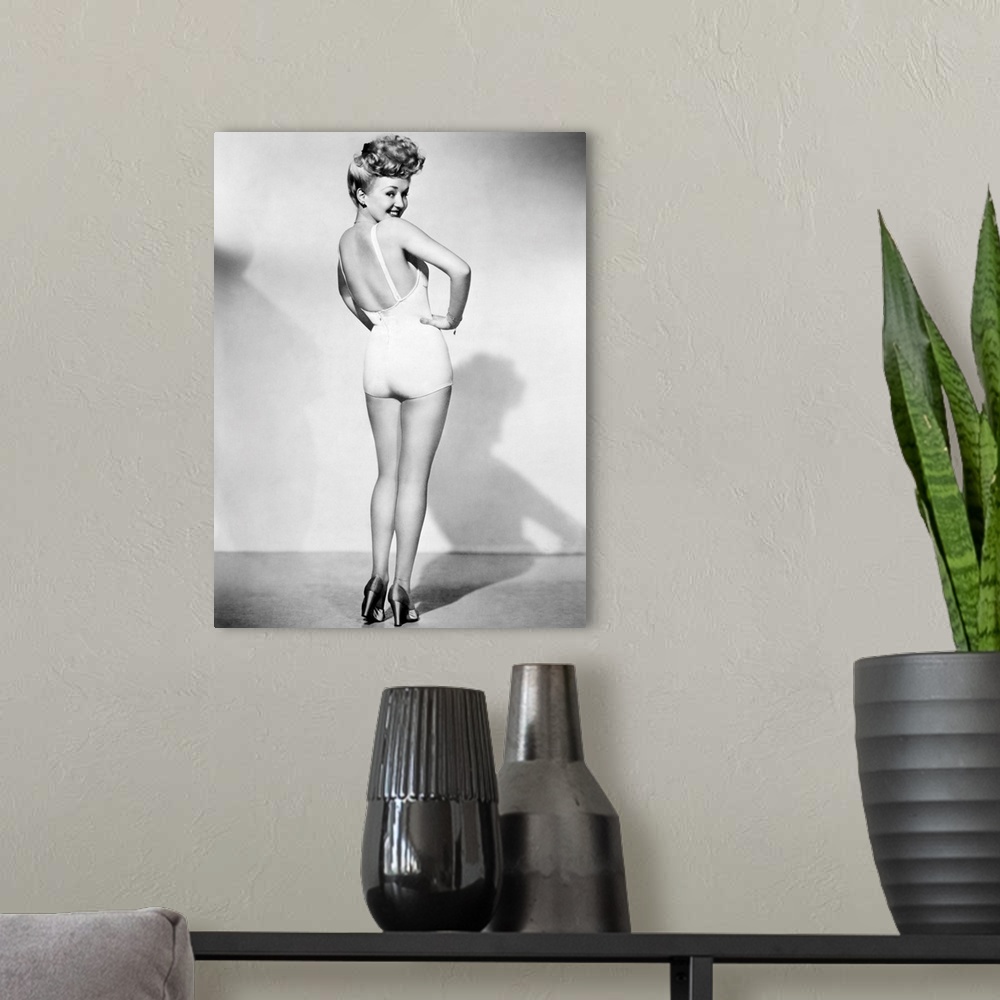 A modern room featuring American actress. The most popular pin-up photograph of the American armed forces during World Wa...