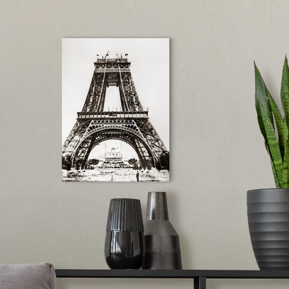 A modern room featuring Building the Eiffel Tower on the Champ de Mars in Paris, France, for the Universal Exposition of ...