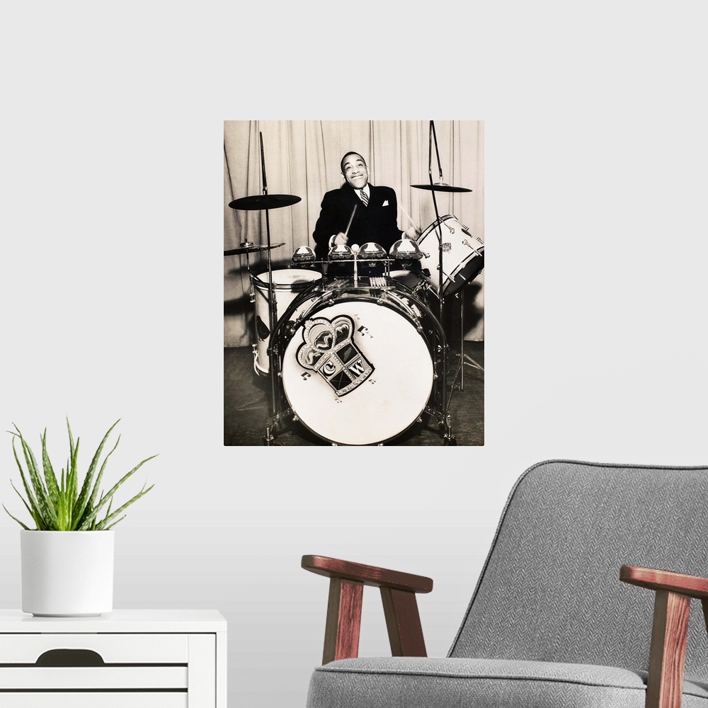 A modern room featuring Born William Henry Webb. American Jazz drummer and big band leader. Photograph, 1930s.