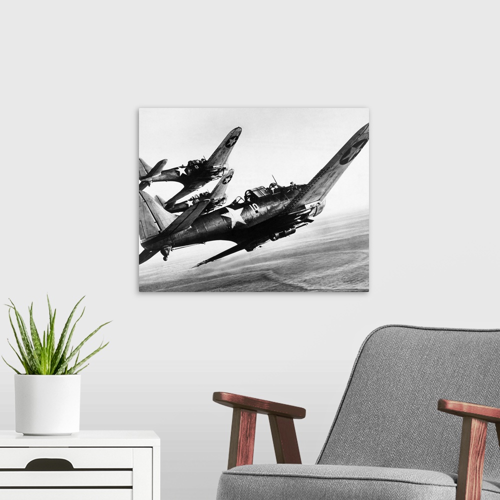 A modern room featuring Three U.S. Navy Douglas SBD 'Dauntless' dive bombers flying over the Pacific Ocean