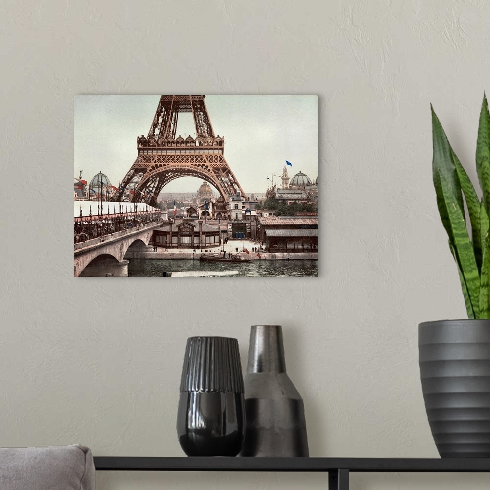 A modern room featuring A view of the Eiffel Tower and a general view of the grounds of the Exposition Universelle of 190...