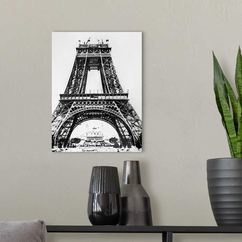 A modern room featuring Building the Eiffel Tower on the Champ de Mars in Paris, France, for the Universal Exposition of ...
