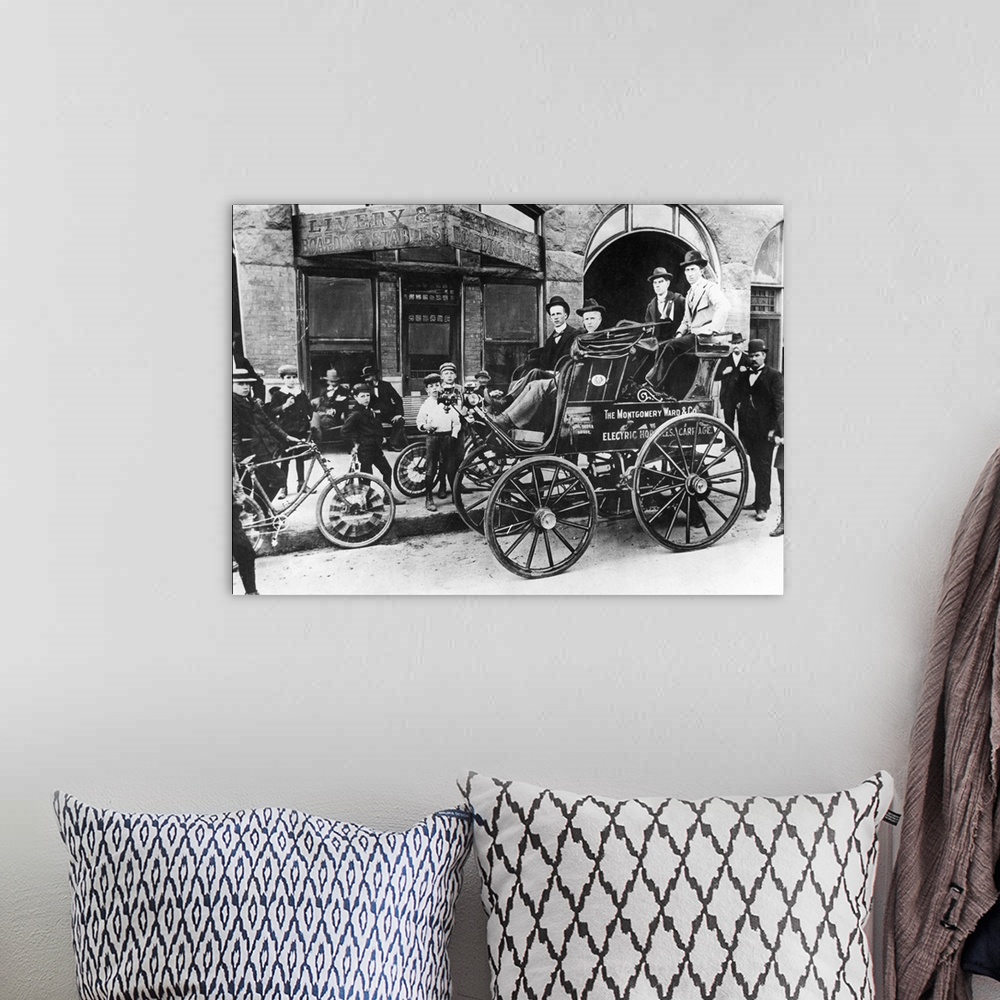 A bohemian room featuring Montgomery Ward's 'Horseless Carriage,' which toured the United States in 1897 as an advertisemen...