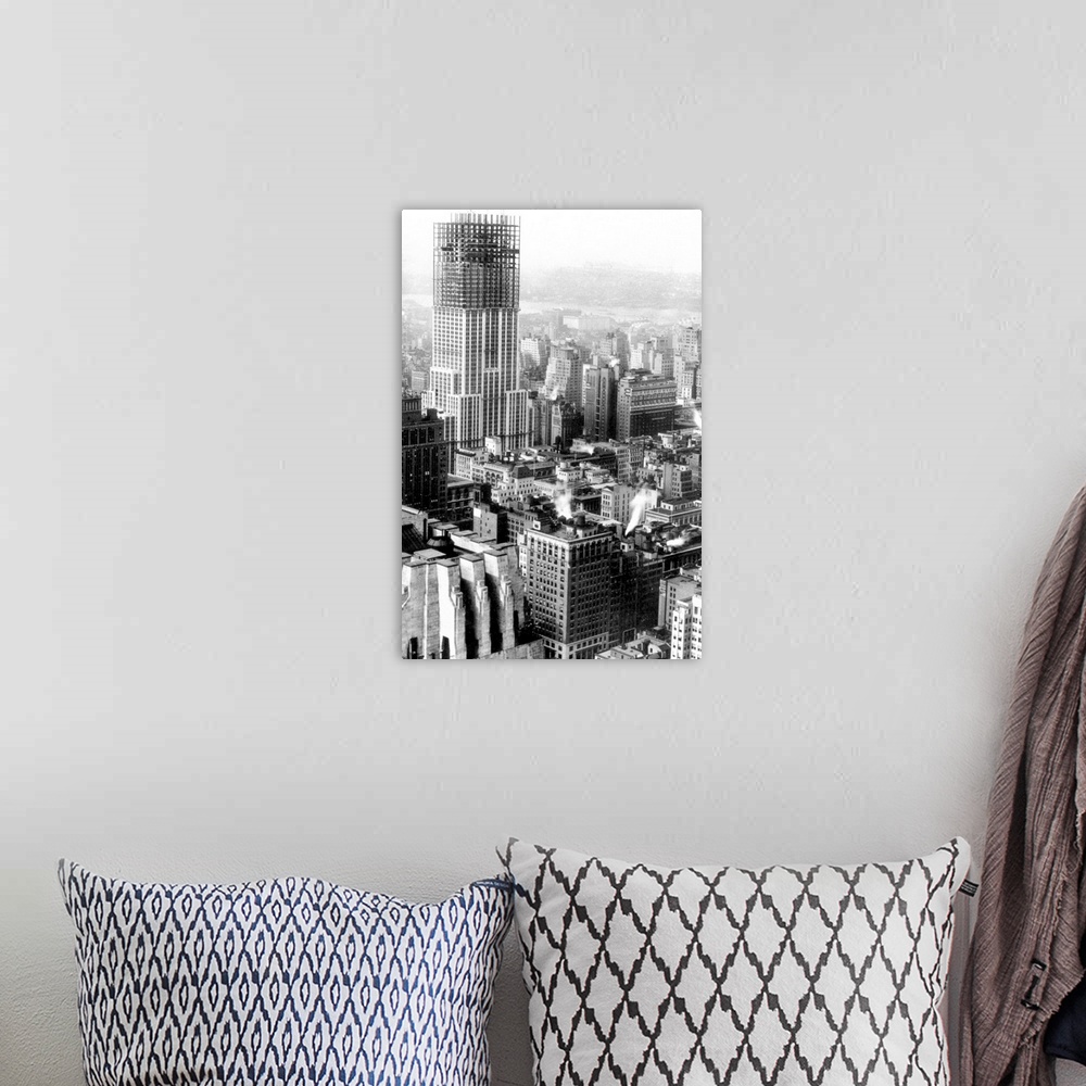 A bohemian room featuring The Empire State Building, New York City, midway through its construction. Photographed in the fa...