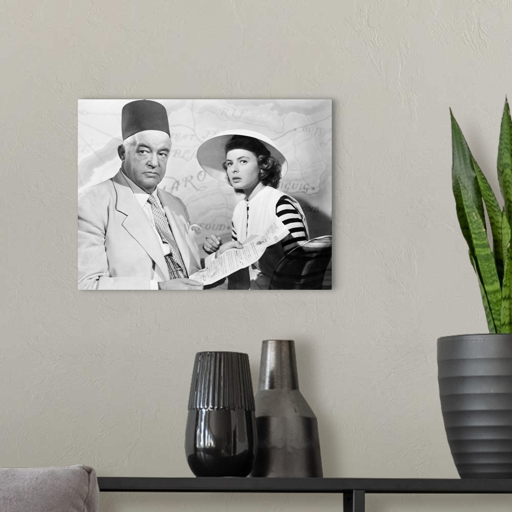 A modern room featuring Sidney Greenstreet and Ingrid Bergman in 'Casablanca' directed by Michael Curtiz, 1942.