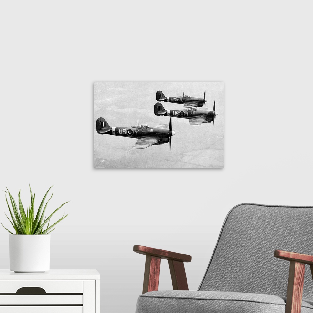 A modern room featuring Three Hawker Typhoon fighter aircrafts of the British Royal Air Force, 1943.