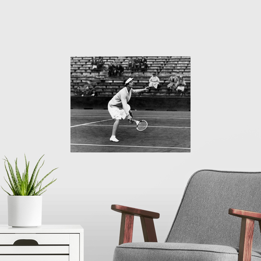 A modern room featuring (1906-1998). American tennis player. Photographed during a match, c1930.