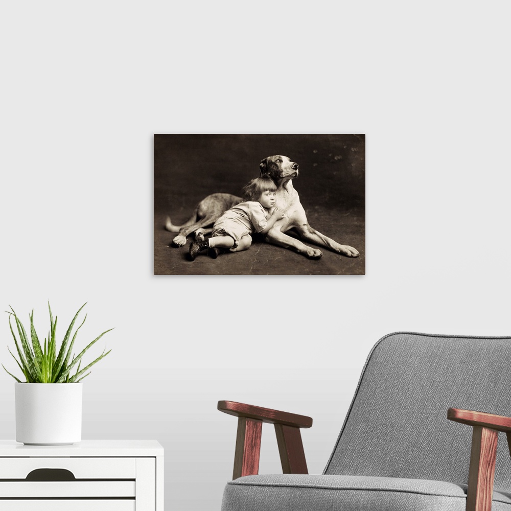 A modern room featuring Child, C1900. 'His Protector.' Original Cabinet Photograph, American, C1900.