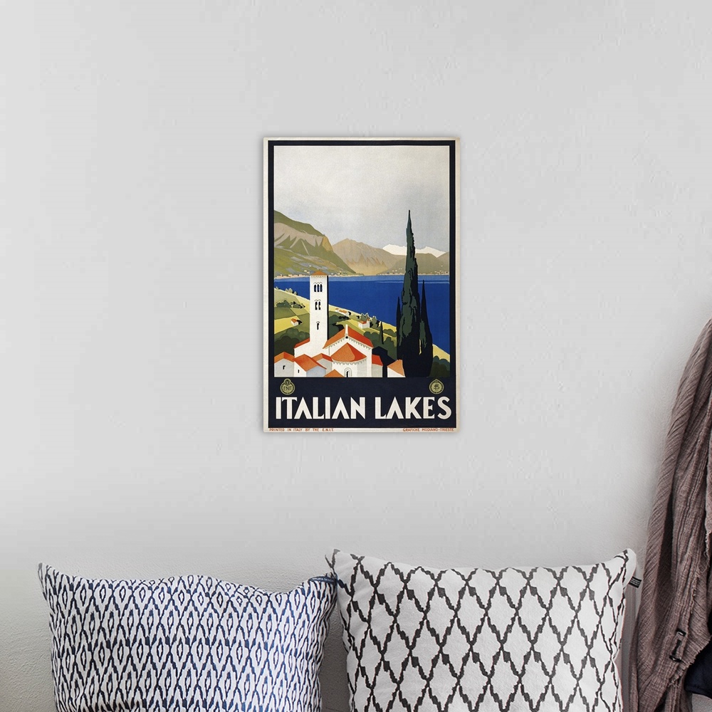 A bohemian room featuring Poster promoting travel to Italy, c1930.