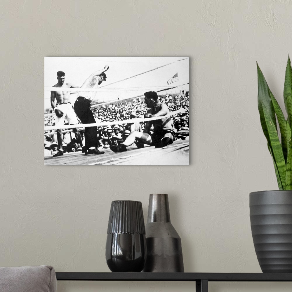 A modern room featuring American boxer. Jack Dempsey (left) winning the heavyweight championship from Jess Willard on 4 J...