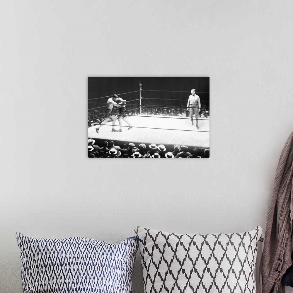 A bohemian room featuring American boxer. Jack Dempsey and Jack Sharkey in the second round of their heavyweight boxing mat...