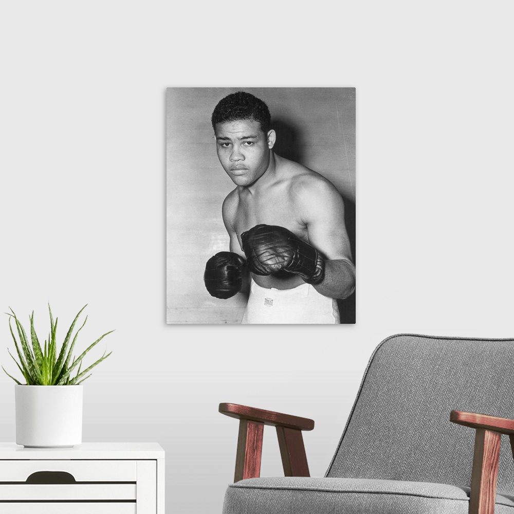 A modern room featuring American heavyweight champion pugilist. Photographed in 1938.