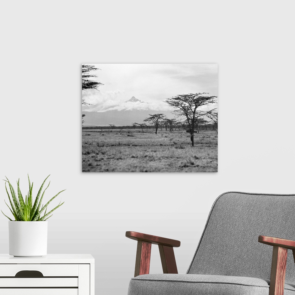 A modern room featuring Landscape view in Kenya, with Mount Kenya seen in the distance. Photographed in 1936.