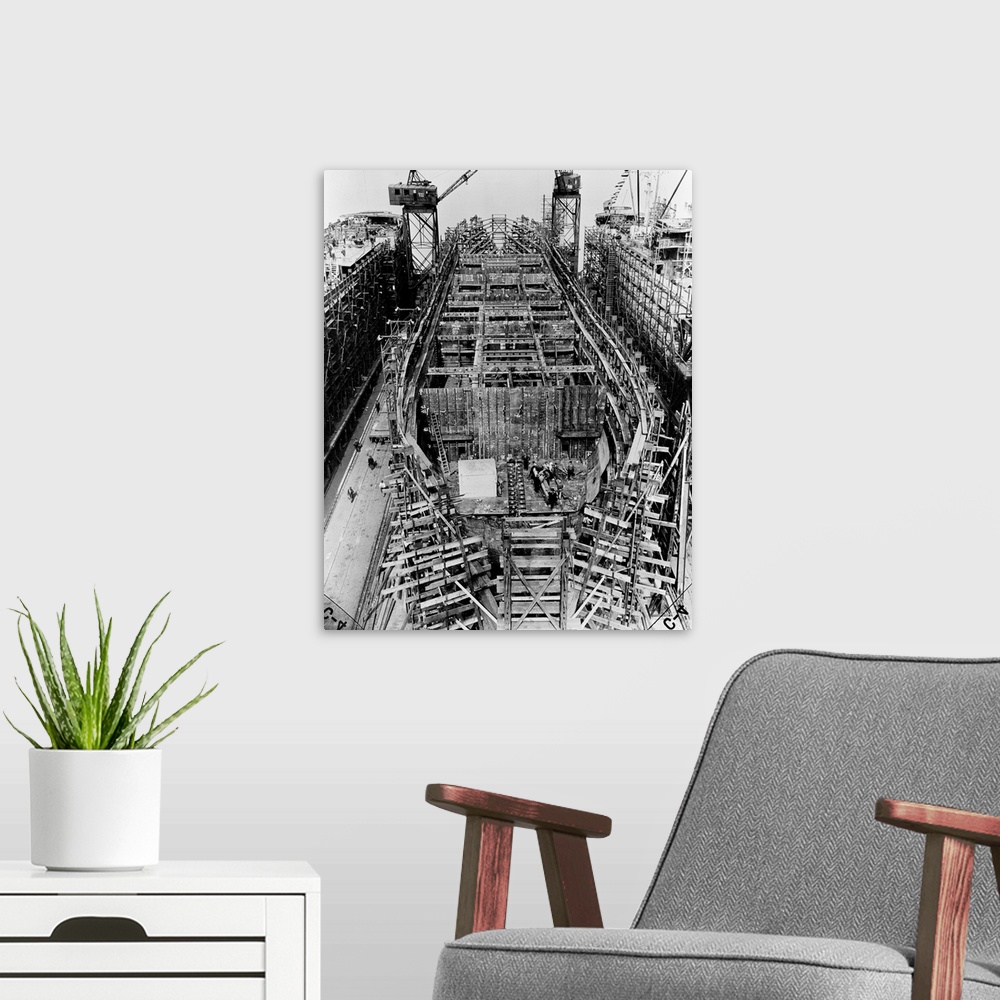A modern room featuring A Liberty Ship under construction at the Bethlehem-Fairfield shipyard in Baltimore, Maryland. Pho...
