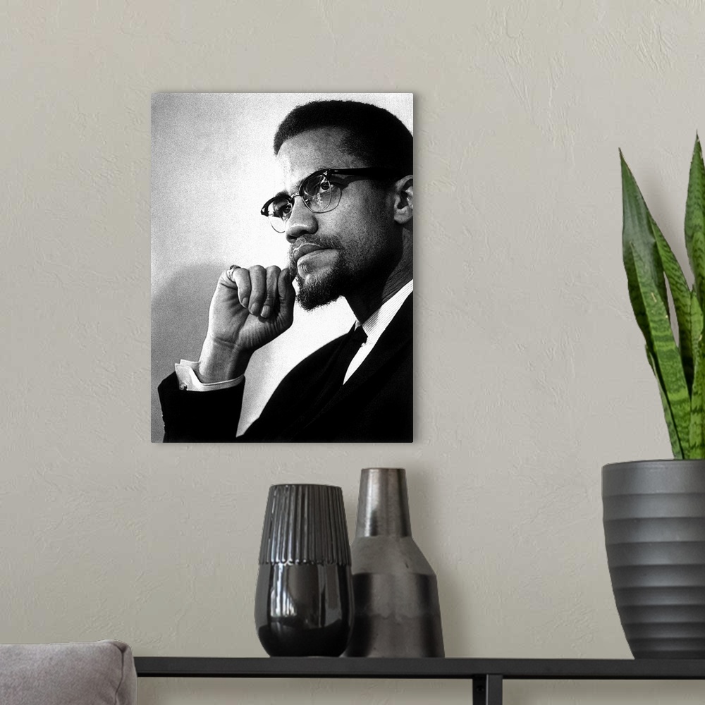 A modern room featuring MALCOLM X (1925-1965). Originally Malcolm Little. American religious and political leader. Photog...