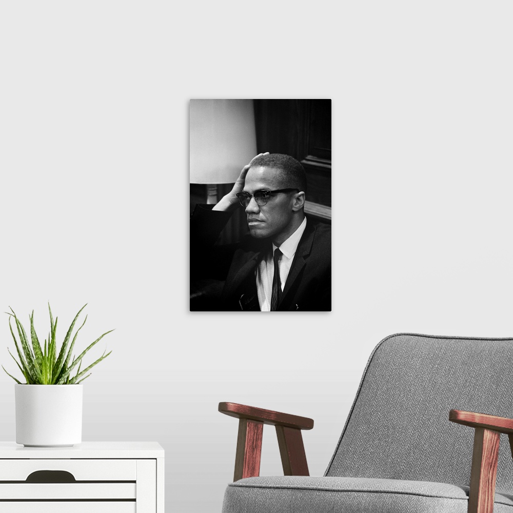 A modern room featuring MALCOLM X (1925-1965). Born Malcolm Little. American religious and political leader. Photographed...
