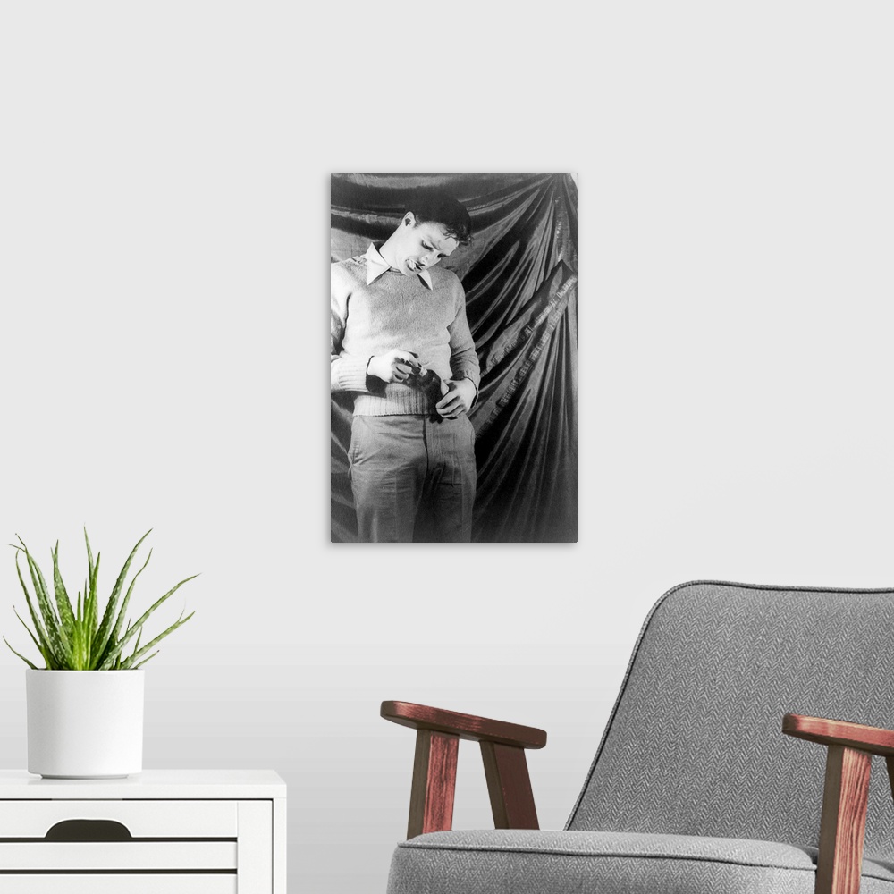 A modern room featuring American actor. Photographed by Carl Van Vechten as the character of Stanley Kowalski in 'A Stree...