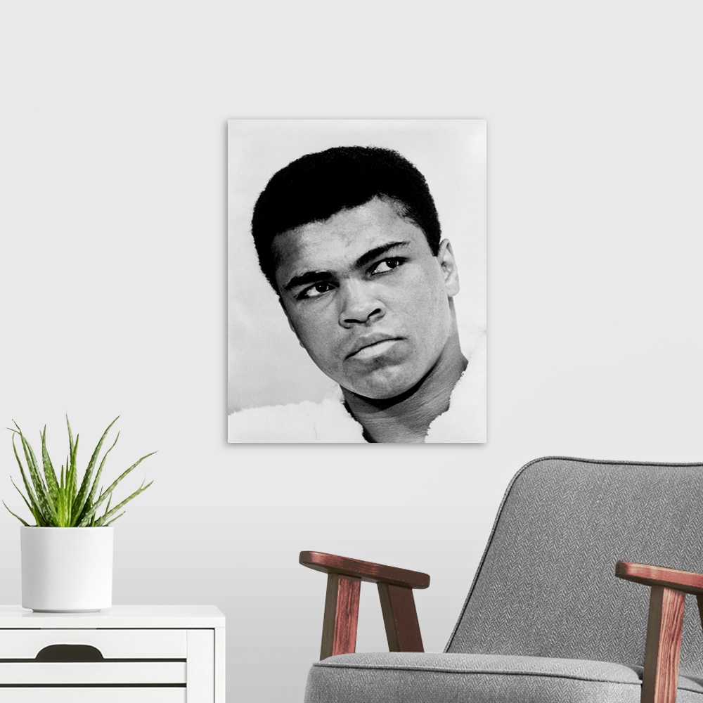 A modern room featuring MUHAMMAD ALI (1942-2016). Nee Cassius Clay. American heavyweight boxer. Photograph by Ira Rosenbe...