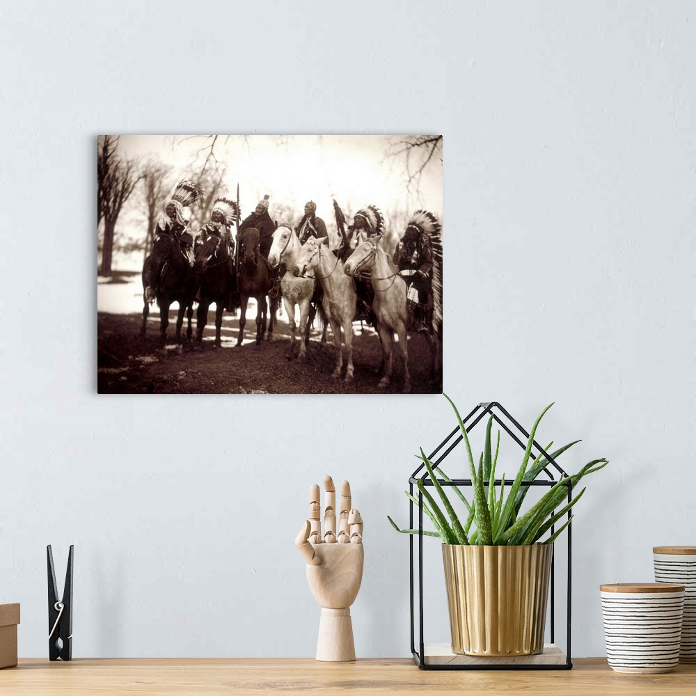 A bohemian room featuring Native American Chiefs. Six Tribal Chiefs, In Ceremonial Attire. Left To Right, Little Plume (Pie...