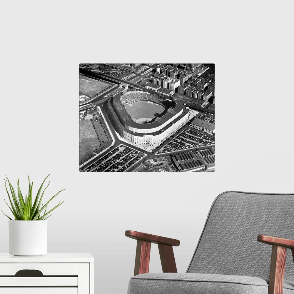 A modern room featuring Aerial view of Yankee Stadium in the Bronx, where an audience of 73,000 is watching the opening g...