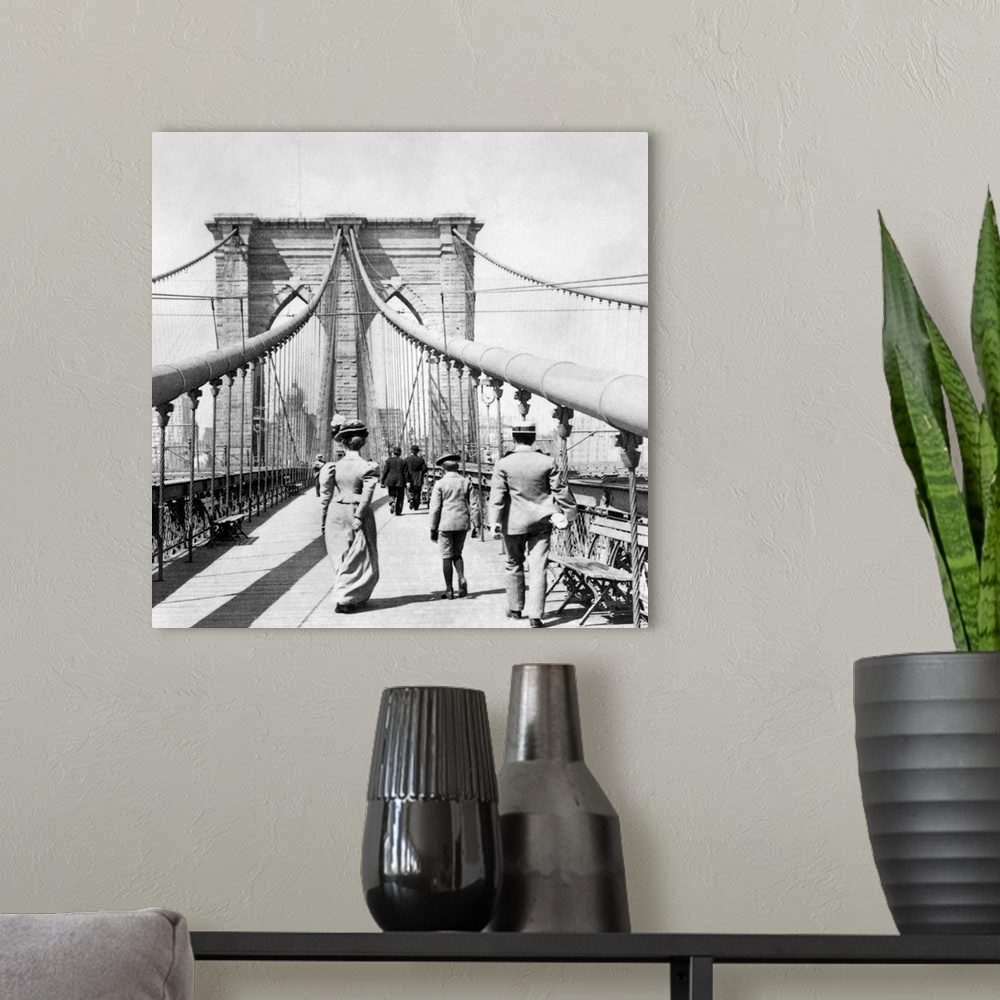 A modern room featuring On the pedestrian promenade of the Brooklyn Bridge. Photograph, from a stereograph view, c1899.