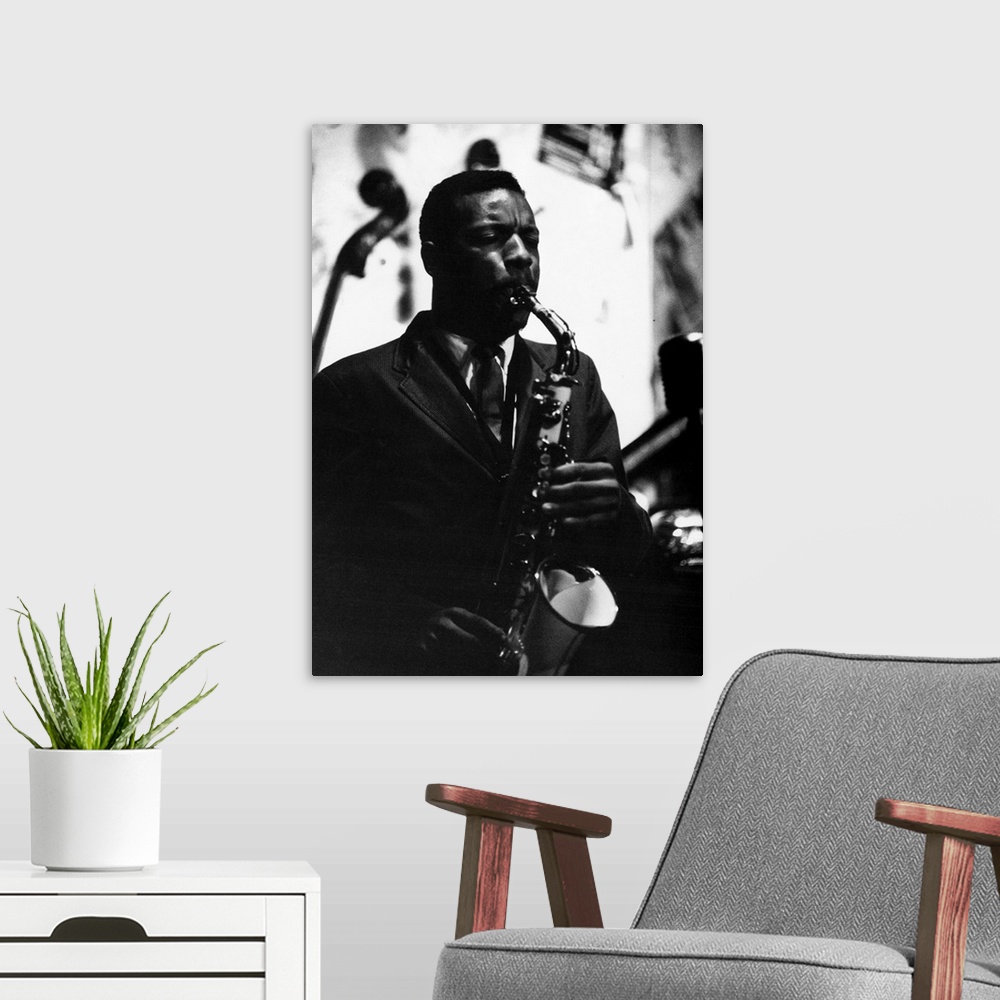 A modern room featuring American saxophonist and composer. Photograph by Bob Parent, c1965.