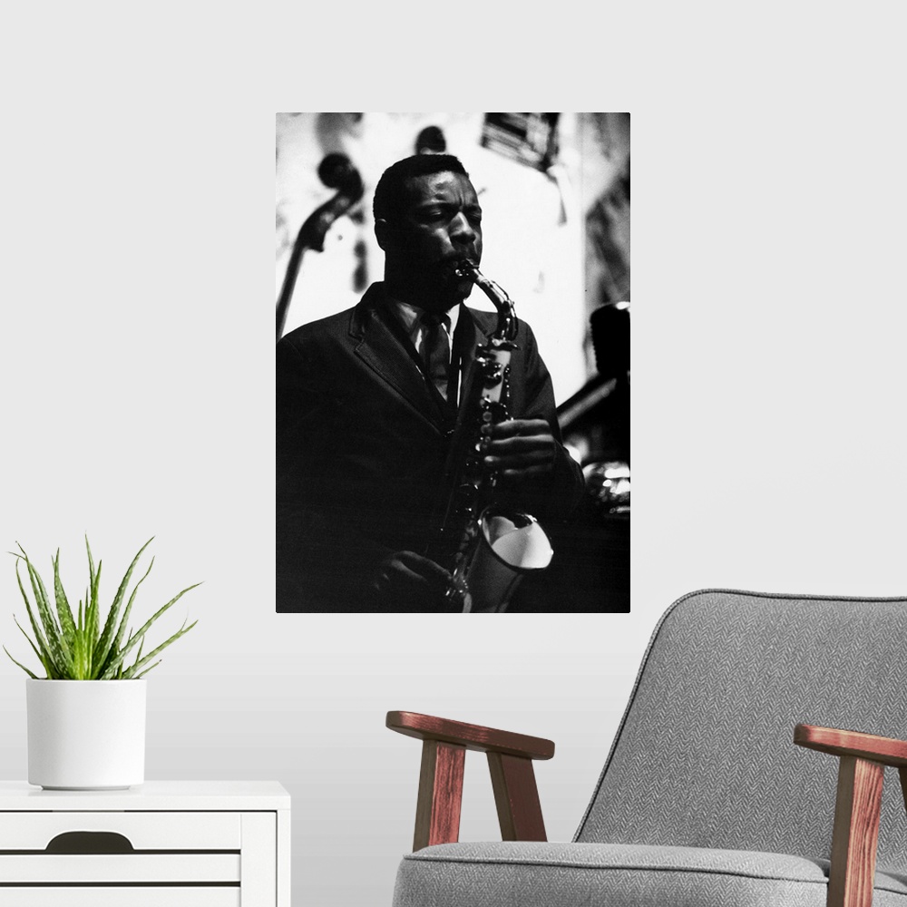 A modern room featuring American saxophonist and composer. Photograph by Bob Parent, c1965.