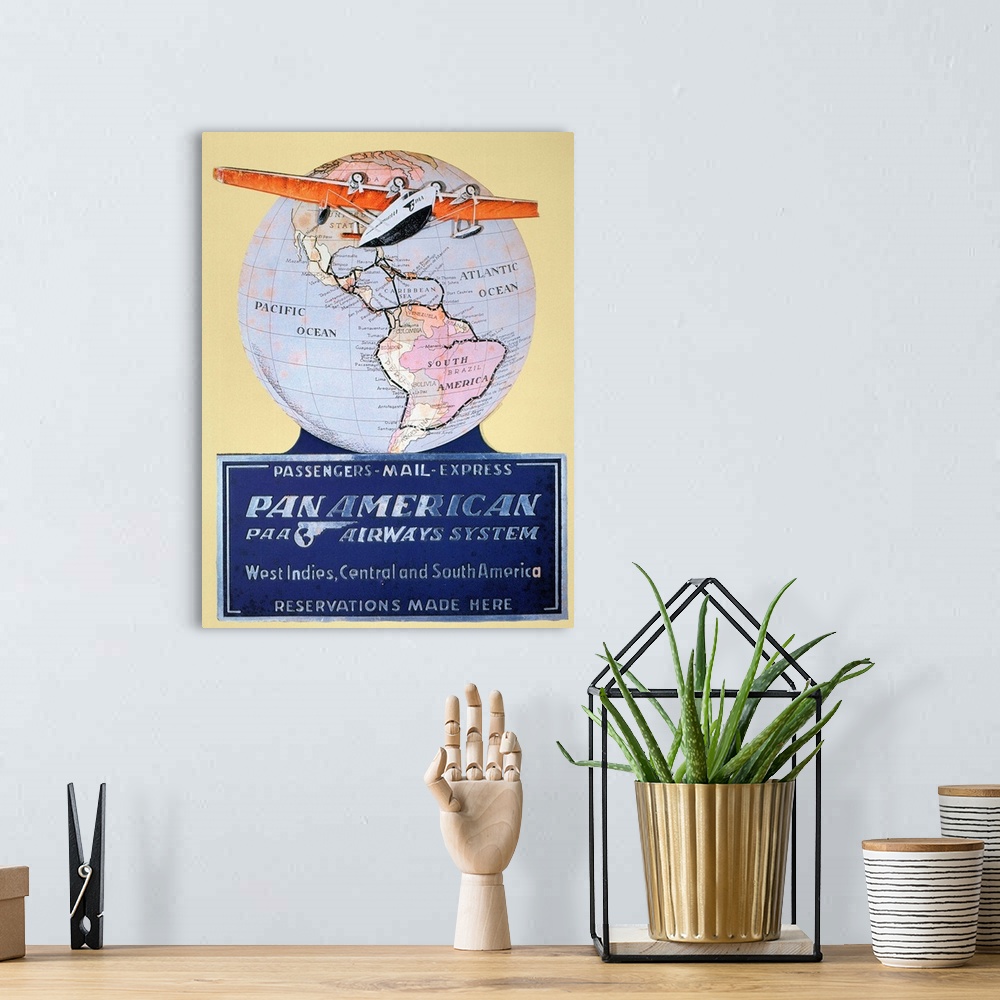 A bohemian room featuring A Pan American Airways display card from 1934 featuring a Sikorsky S-42 airplane.