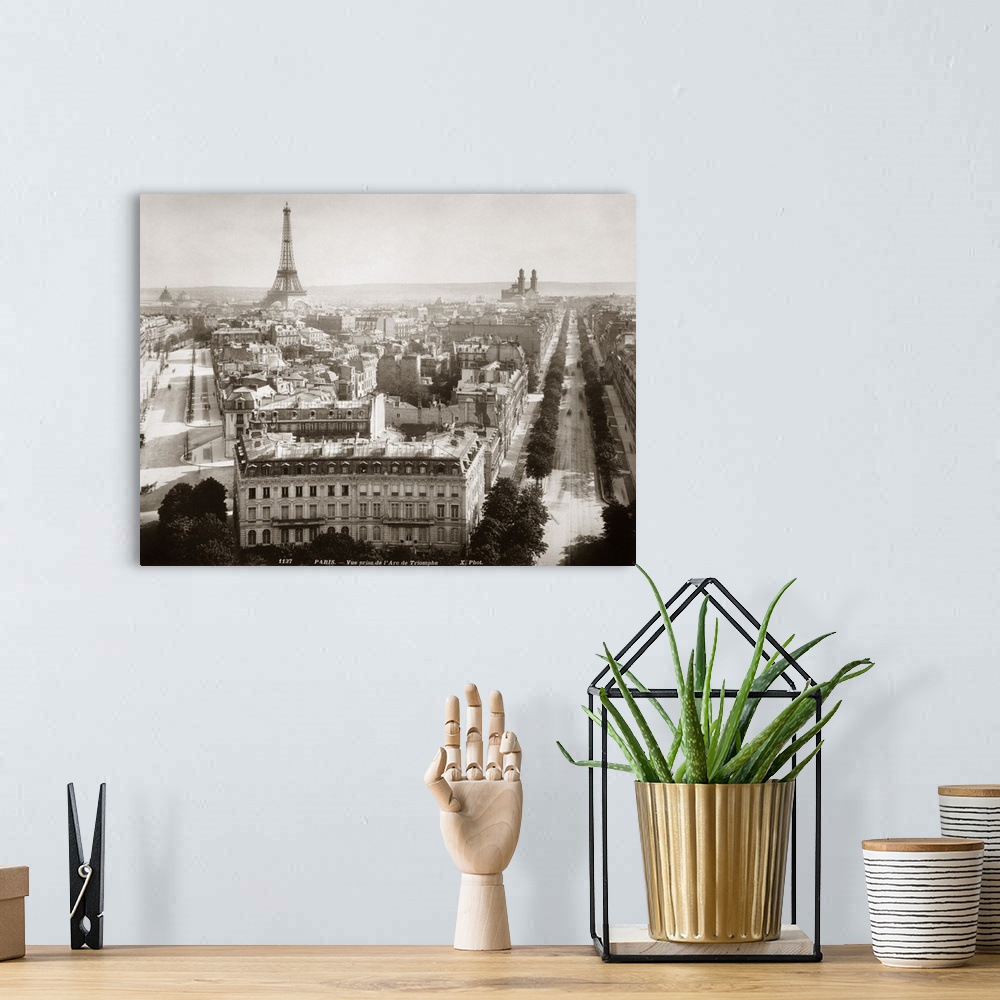 A bohemian room featuring View of Paris form l'Arc de Triomphe, c1900. On th left Avenue Marceau runs towards the Eiffel To...