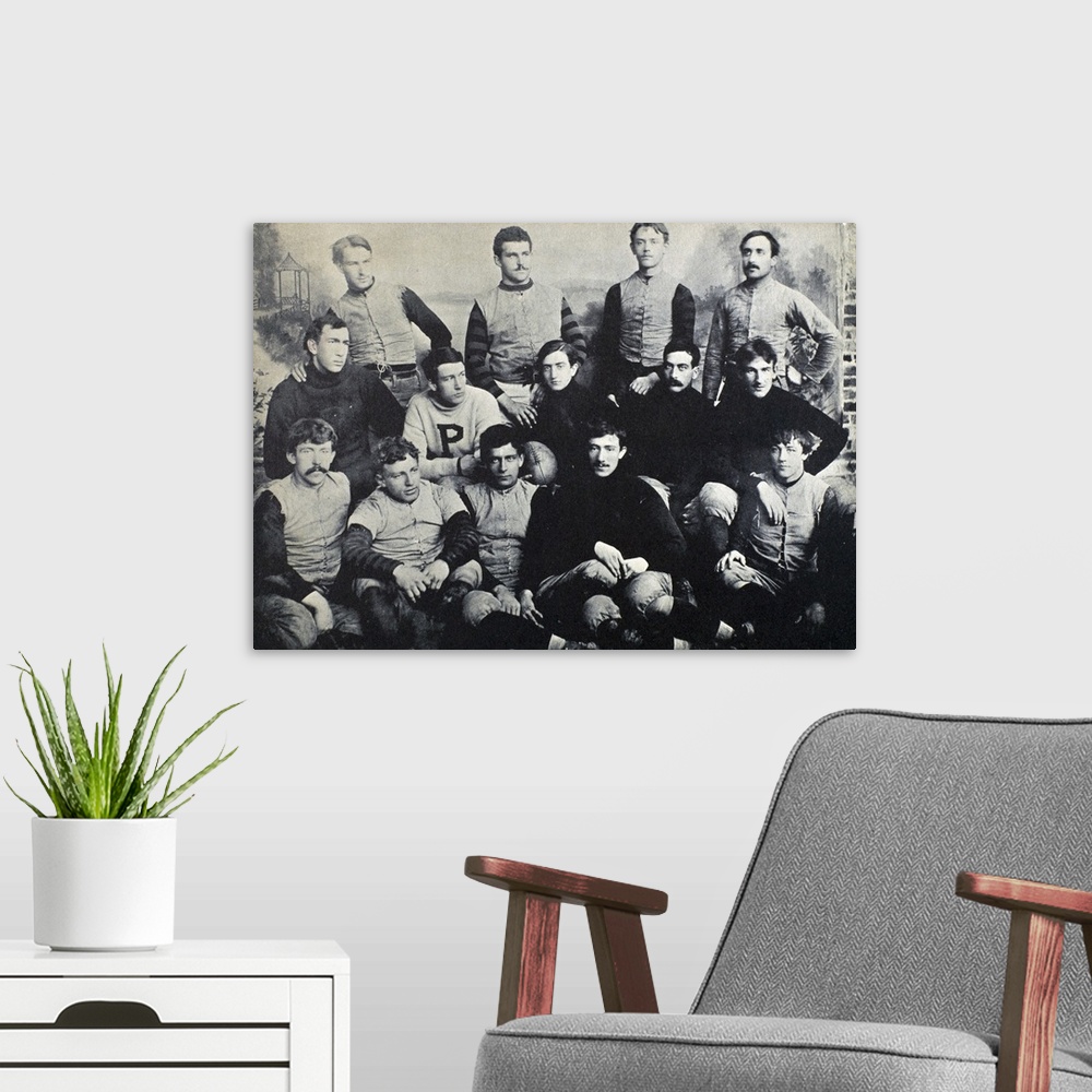 A modern room featuring The Princeton football team of 1890. Holding the football is the captain of the team, Edgar Allan...