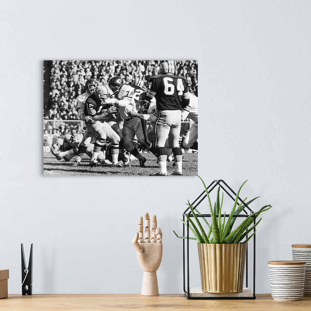 A bohemian room featuring Quarterback Bart Starr of the Green Bay Packers being sacked for an 11-yard loss by Dick Butkus a...