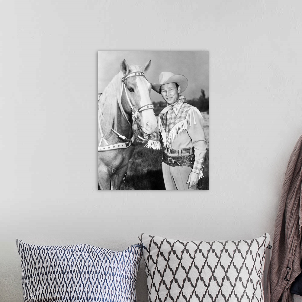 A bohemian room featuring Leonard Slye. American singing cowboy actor. With his horse, Trigger.