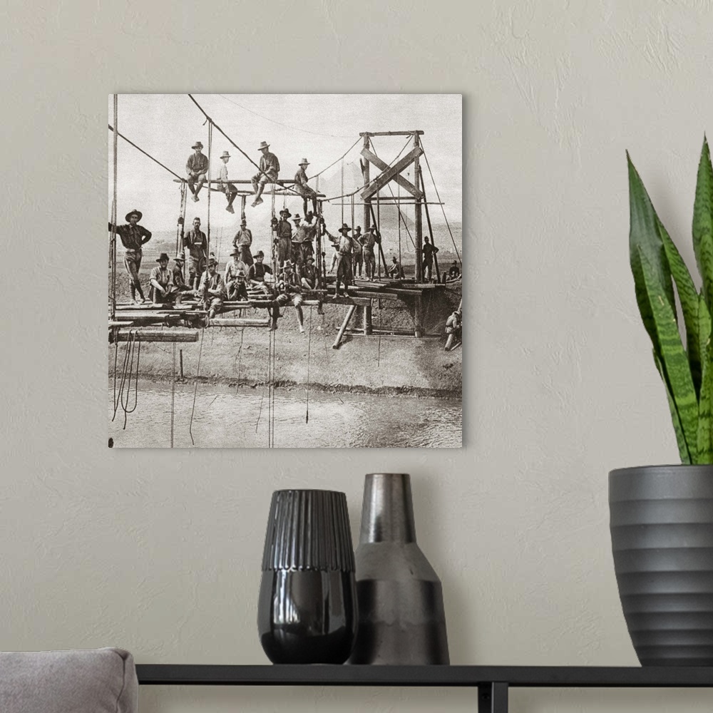 A modern room featuring Suspension bridge in the course of construction over the irrigation canal near the Australian cam...
