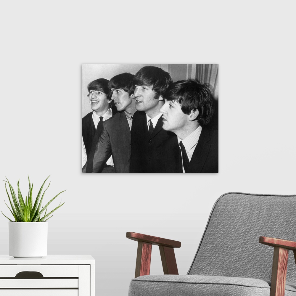 A modern room featuring From left to right: Ringo Starr, George Harrison, John Lennon, and Paul McCartney.