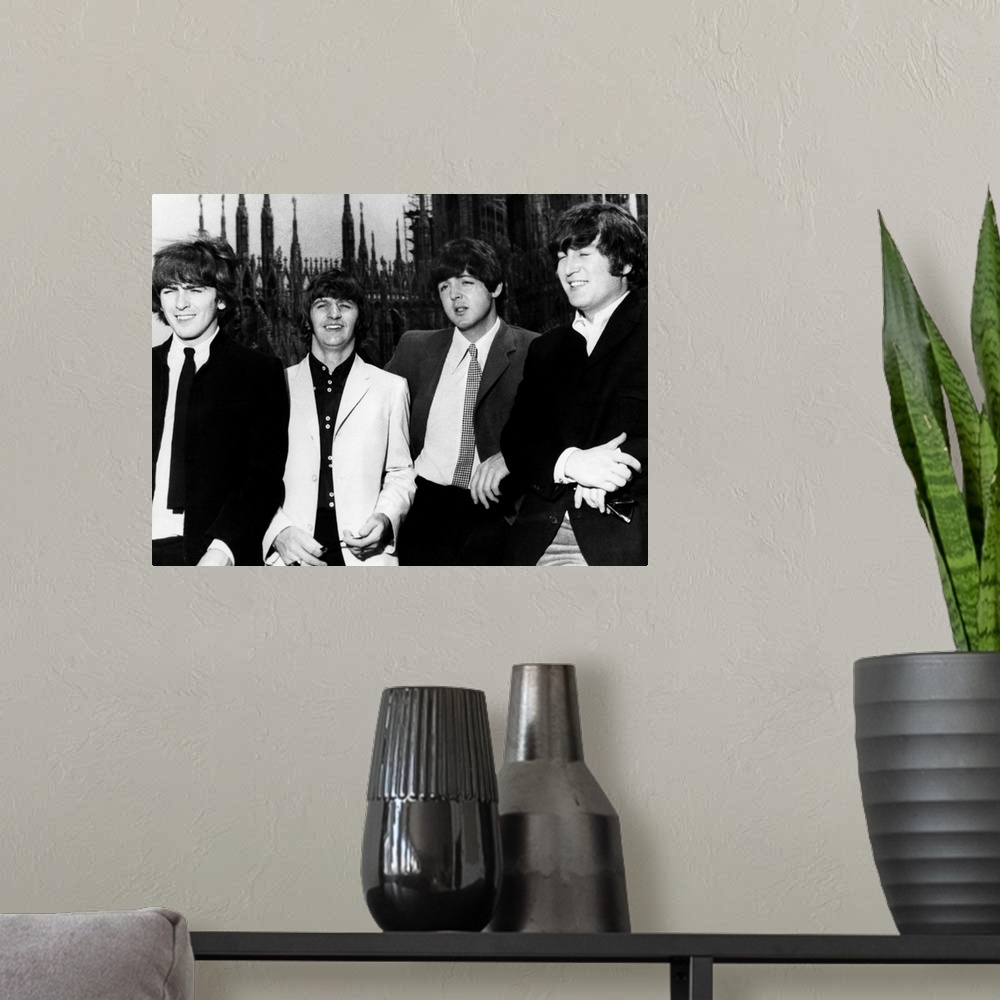 A modern room featuring The Beatles in Milan, Italy. Photograph, 1965. Left to right: George Harrison, Ringo Starr, Paul ...