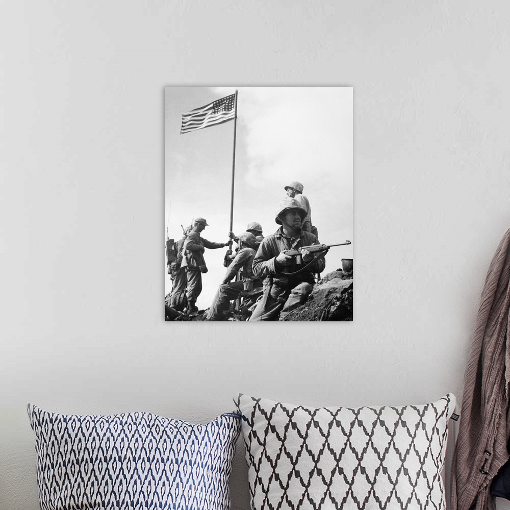 A bohemian room featuring The raising of the first flag on Mount Suribachi, Iwo Jima, 23 February 1945. The soldiers are Se...