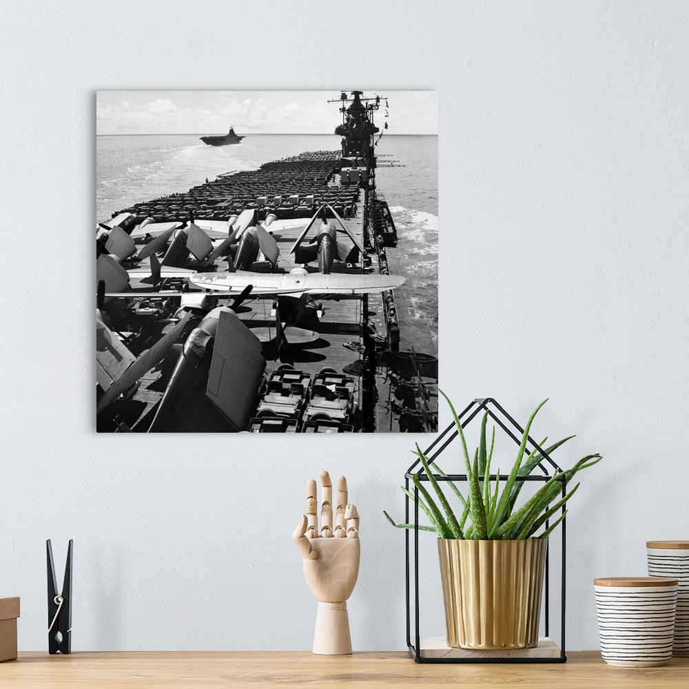 A bohemian room featuring The USS Yorktown aircraft carrier ferries planes and jeeps to battle fronts in the Pacific. Photo...
