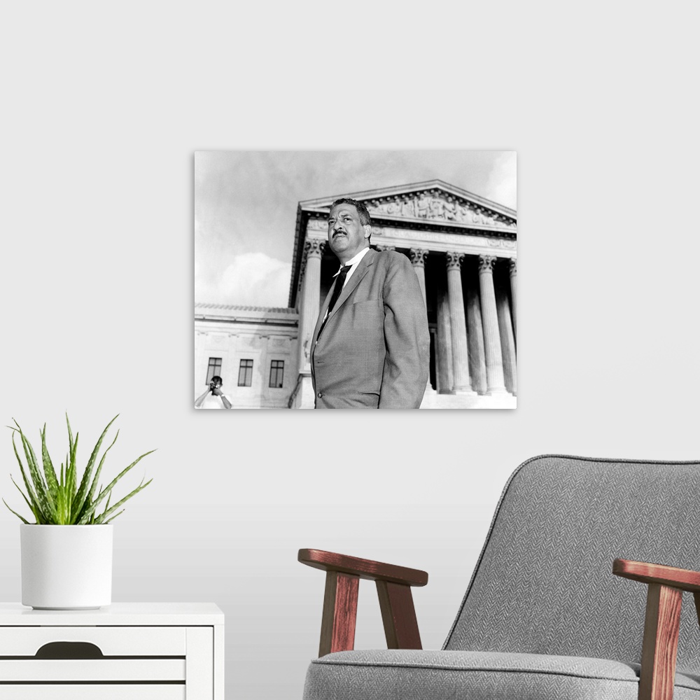 A modern room featuring THURGOOD MARSHALL (1908-1993). American jurist. Photographed before the Supreme Court in Washingt...