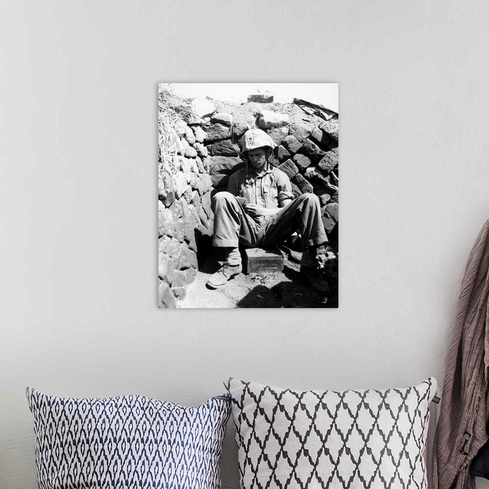 A bohemian room featuring Portrait of U.S. Marine PFC Keith A. Cole sitting in a foxhole on Iwo Jima. Photograph, 1 March 1...