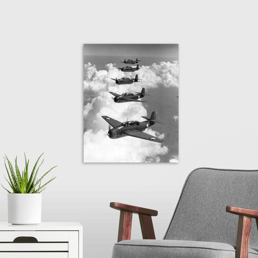 A modern room featuring U.S. Navy Grumman Avenger torpedo bombers, 1942.