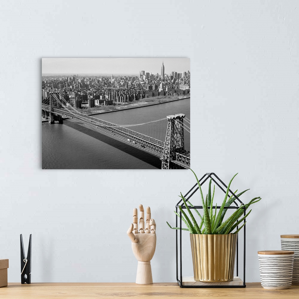 A bohemian room featuring The Williamsburg Bridge spanning the East River from Brooklyn to Manhattan in New York. Photograp...