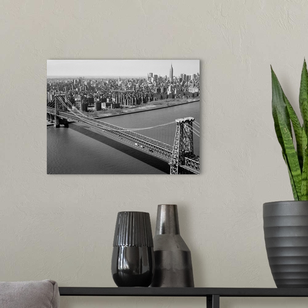 A modern room featuring The Williamsburg Bridge spanning the East River from Brooklyn to Manhattan in New York. Photograp...