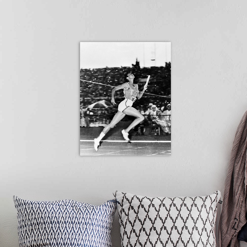 A bohemian room featuring American track and field athlete. Crossing the finish line to win the 400-meter relay for the Uni...