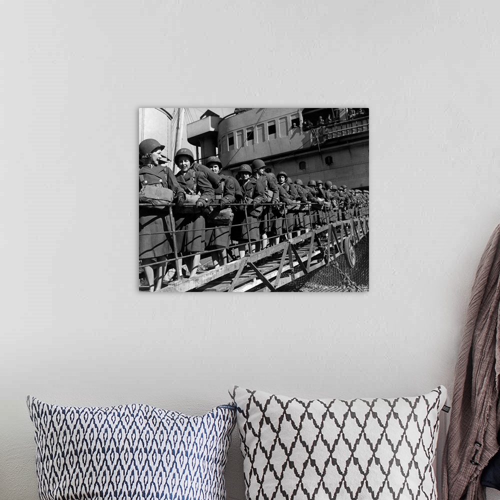 A bohemian room featuring Members of the Women's Army Corps disembark at a North African port during World War II. Among th...