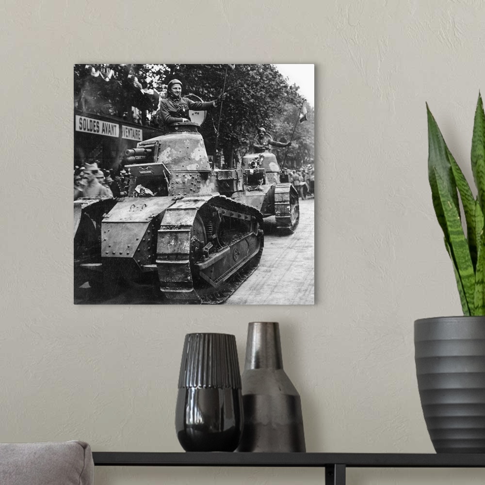 A modern room featuring French tank parading through the streets of Paris. From a stereograph, 1918.