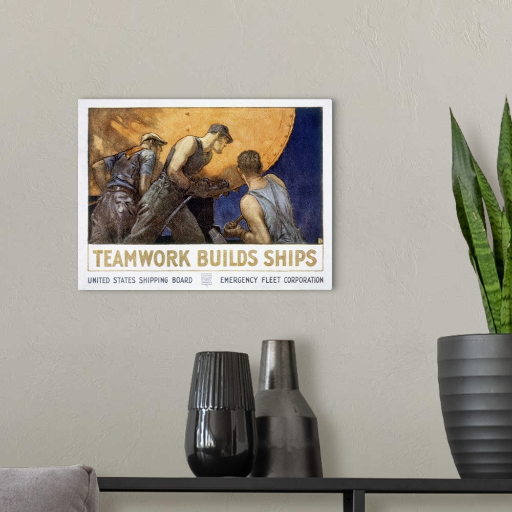 A modern room featuring 'Teamwork builds ships.' American World War I United States Shipping Board poster.